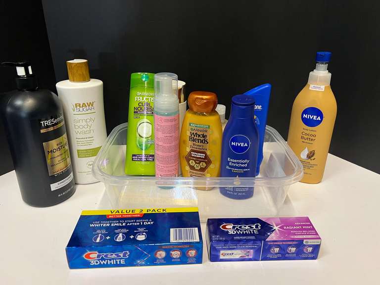 Assorted toiletries to include shampoo, Toothpaste, moisturizer, and more. Tub is not included, see pictures for details. ￼ image