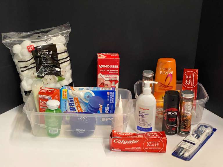 Shelf lot marked 6112 of assorted toiletries to include Axe body spray, toothpaste, Gillette razors, conditioner, toothpaste, and more. Tubs are not included, see pictures for details. image