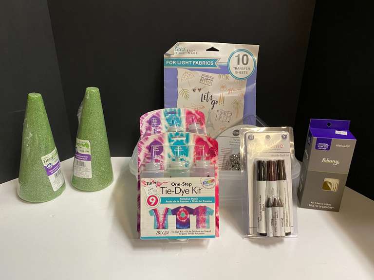 Assorted crafting supplies to include foam cones, tie-dye kits, decorative nail head trim, and more. Tubs are not included, see pictures for details. image