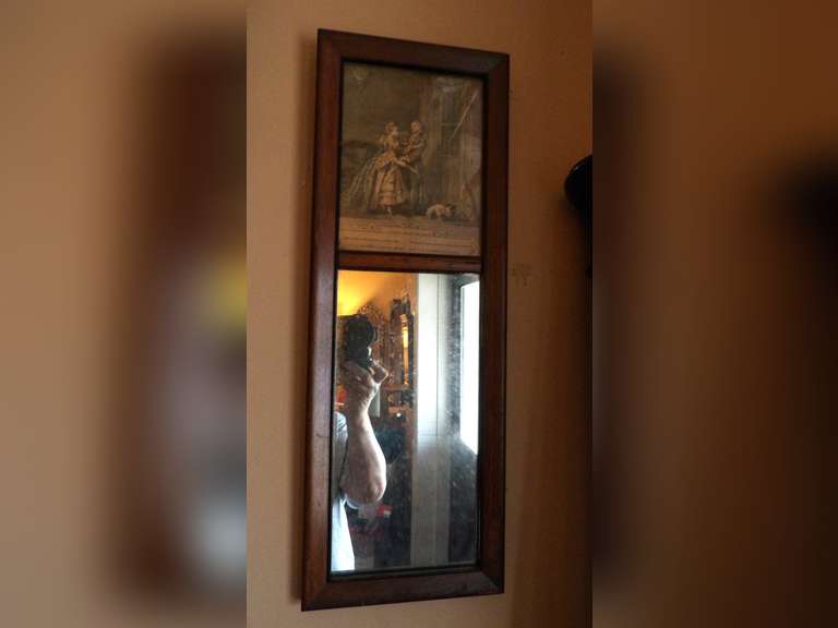 ANTIQUE MIRROR WITH FRAMED ARTWORK AT TOP image