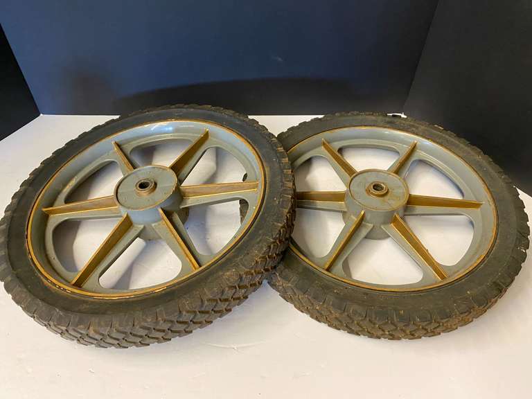 Wheels with rims, believed to be for a mower or yard cart, see pictures for details. image