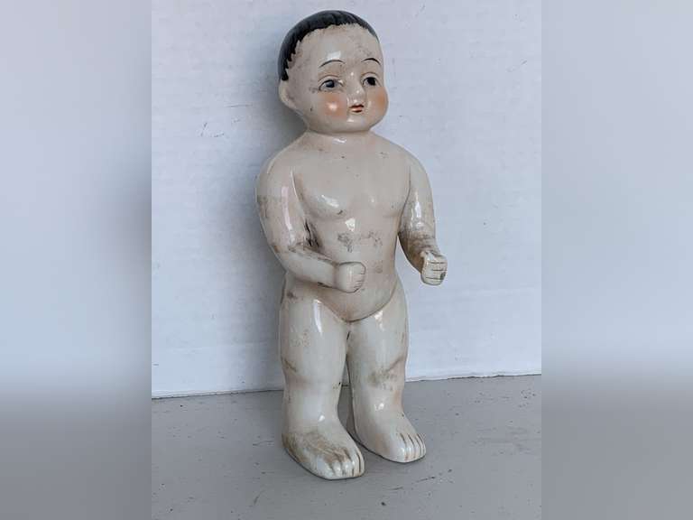 ANTIQUE "FROZEN CHARLIE" BATHING BOY PORCELAIN DOLL 7 1/2" WITH PINK CHEEKS & BLACK HAIR WITH WISPS AROUND FACE image