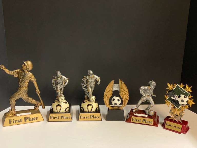 Small first place trophies for soccer, and one for baseball, see pictures for details. image