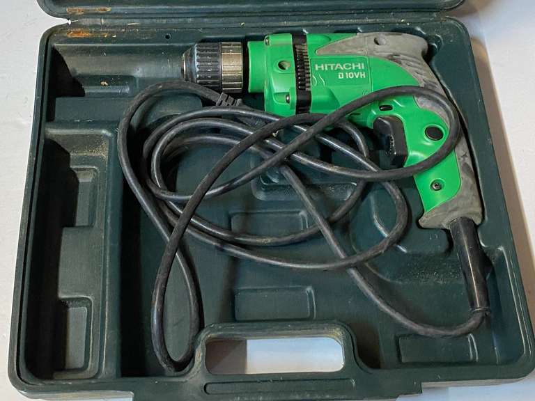 Hitachi electric 3/8 drill with carrying case, powers up, see pictures for details. image