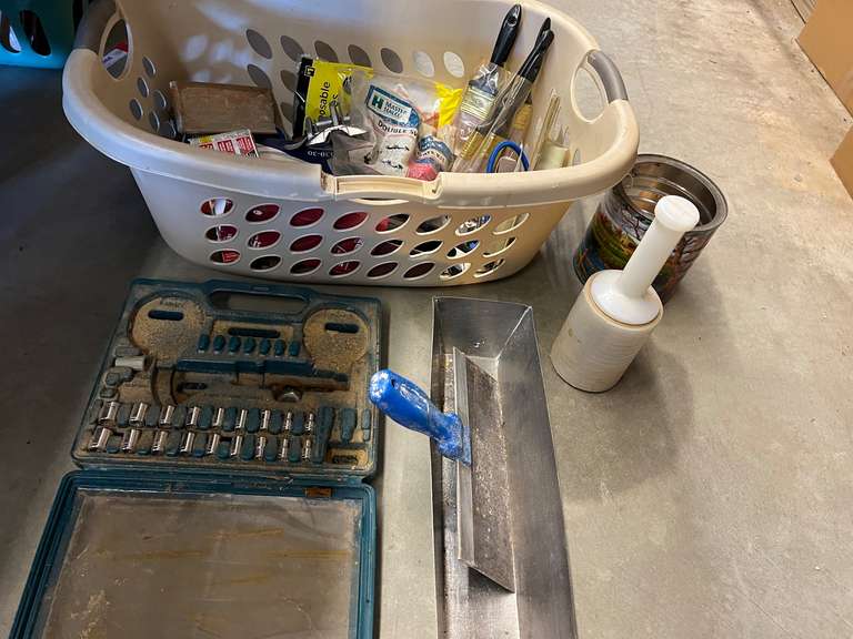 Assortment of household goods to include drywall mud pan and knife, sockets, paint brushes, concrete edger, notched trowel, and more. See pictures for details. image