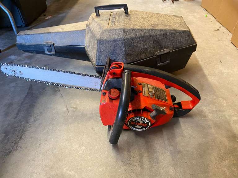 Homelite chainsaw with carrying/storage case, not locked up, see pictures for details. image