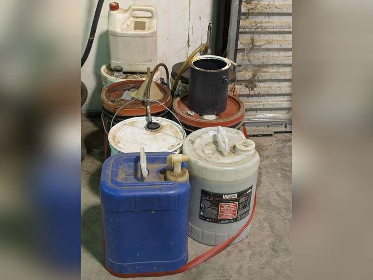 ALL CONTAINERS OF SHOP CHEMICALS IN AREA MARKED 1008 INCLUDING TIRE PUNCTURE SEALANT, HYDRAULIC FLUID, CONCRETE SEALING COMPOUND, GREASE GUN, 5 GALLON PUMP LID, AND MORE image