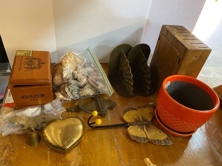 Assorted home decor to include collectible shells, brass bookends, planter, door knocker, and more. See pictures for details. image