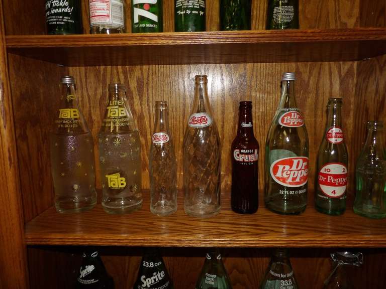 LOT OF EIGHT MIXED COLLECTIBLE BOTTLES ORANGE CRUSH DR PEPPER, PEPSI, TAB AND MORE image