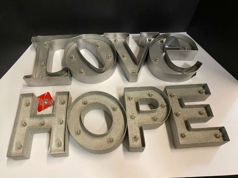 Shelf lot marked 6110 to include two holiday marquees, hope and love, see pictures for details. ￼ image