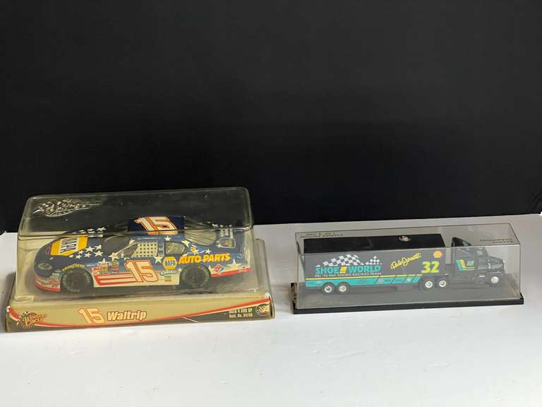 #15 diecast NASCAR replica, 1/24 scale, comes in original box, also includes #32 race team hauler replica, comes with a display case, see pictures for details. image