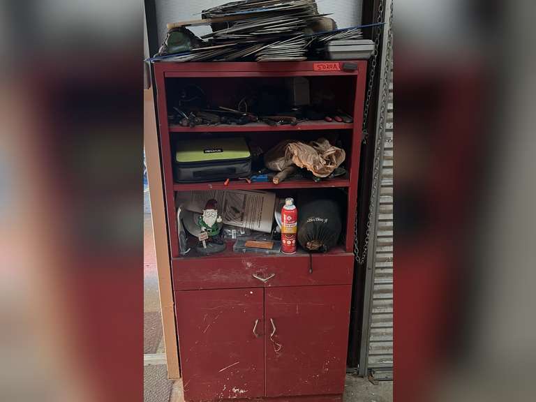 Metal shop shelf, includes shelf and all content of assorted hand tools, license plates, and more. Also includes vintage drink bottles above shelf, see pictures for details. ￼ image