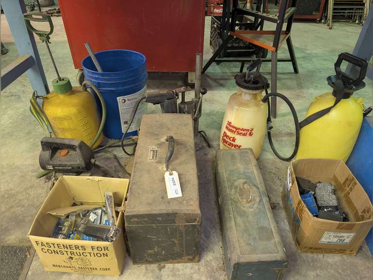 ALL ITEMS BELOW SHOP TABLE MARKED 1052 INCLUDING VINTAGE METAL TOOL BOXES, PUMP SPRAYERS, DRILL PRESS, THERMO-FOGGER, HEAVY DUTY STAPLERS, AND MORE image