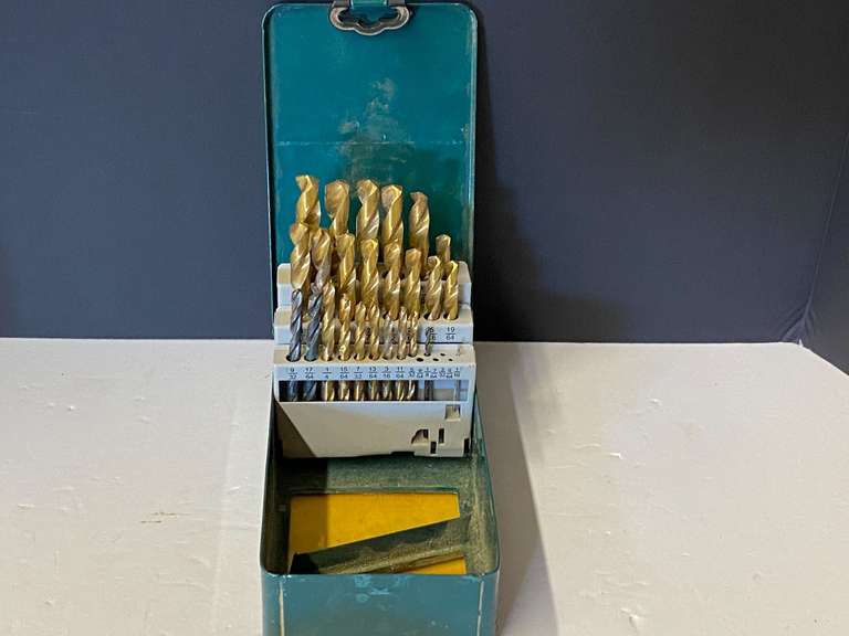Assorted drill bits with metal storage case, see pictures for details. image