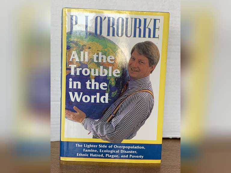 1994 FIRST EDITION "ALL THE TROUBLE IN THE WORLD" HARDBACK BOOK image