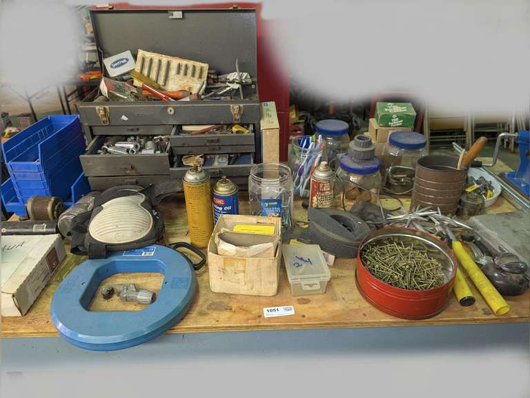 ALL ITEMS ON TOP OF WORK TABLE MARKED 1051 INCLUDING LARGE STACK-ON TOOL BOX WITH CONTENTS, TOOLS, NAILS, CENTRAL MACHINERY CHAINSAW CHAIN BREAKER / SPINNER, THREADED ROD, AND MORE image