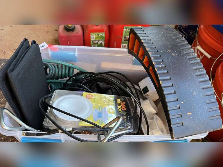 Mystery tub of assorted items, includes 360 siphon, RV vent cap, corkscrew ground anchors, cable cord, camper leveler, and more. See pictures for details. image