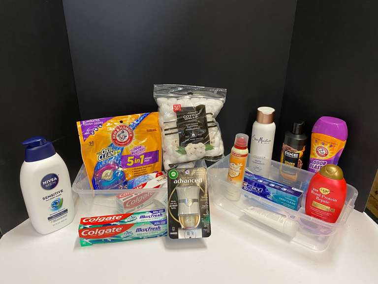 Shelf lot marked 6117 of assorted toiletries to include whole body deodorant, toothpaste, body wash, cotton balls, shampoo, and more. Tubs are not included, see pictures for details. image