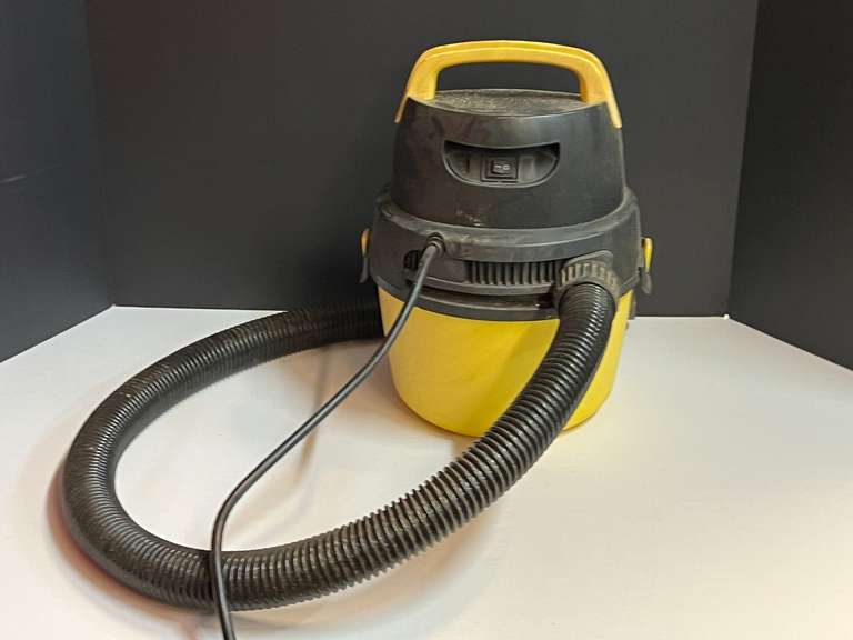 Small wet dry vac, powers up, see pictures for details. image