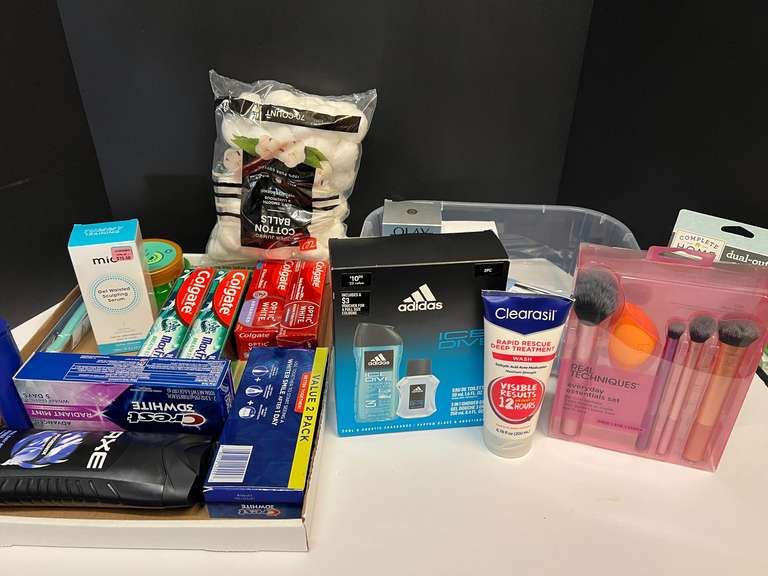 Assorted toiletries to include body sugar scrub, toothpaste, men’s shower gel and fragrance set, make up removers, and much more. Tub is not included, see pictures for details. image