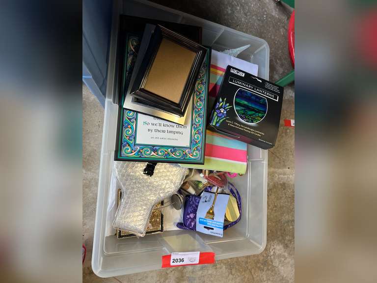 Garage… Mystery lot of assorted household items to include an accent pillow, lodge socks, lodge slippers, and more. See pictures for details. image