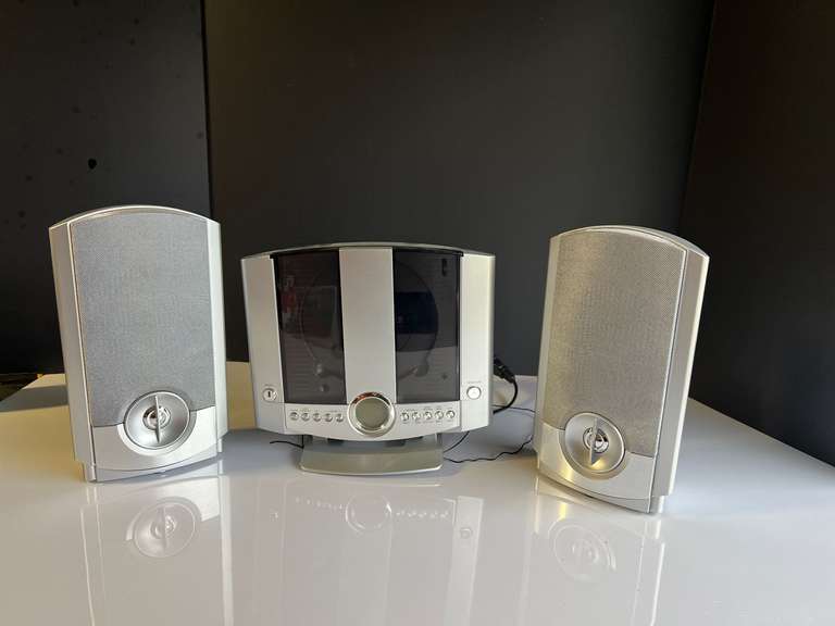 Garage… Small home music system, vertical CD player, and AM/FM radio, powers up, comes with the original box, see pictures for details. image