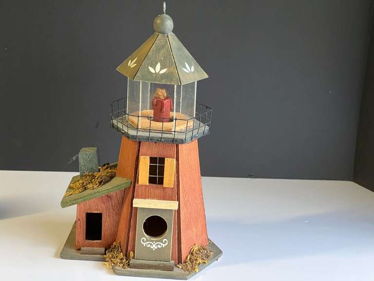 Garage… Wooden lighthouse decor, one of the roof panels is missing, see pictures for details. image