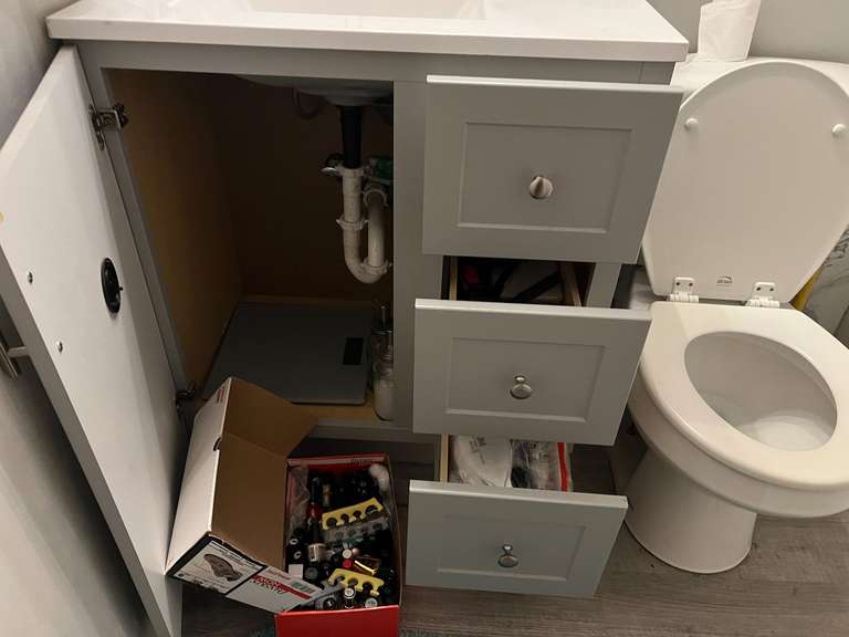 Hall bath… All content of hallway bathroom not attached to house. Some items include assorted perfumes, nail polish, curling irons, and more. See pictures for details. image