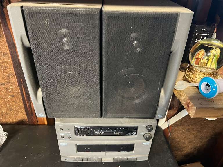 Garage… GE stereo system with dual cassette deck, tuner, and speakers. This piece powers up, see pictures for details. image