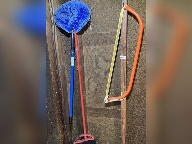 Garage… 30” bow saw, broom and ceiling fan brush, see pictures for details. image