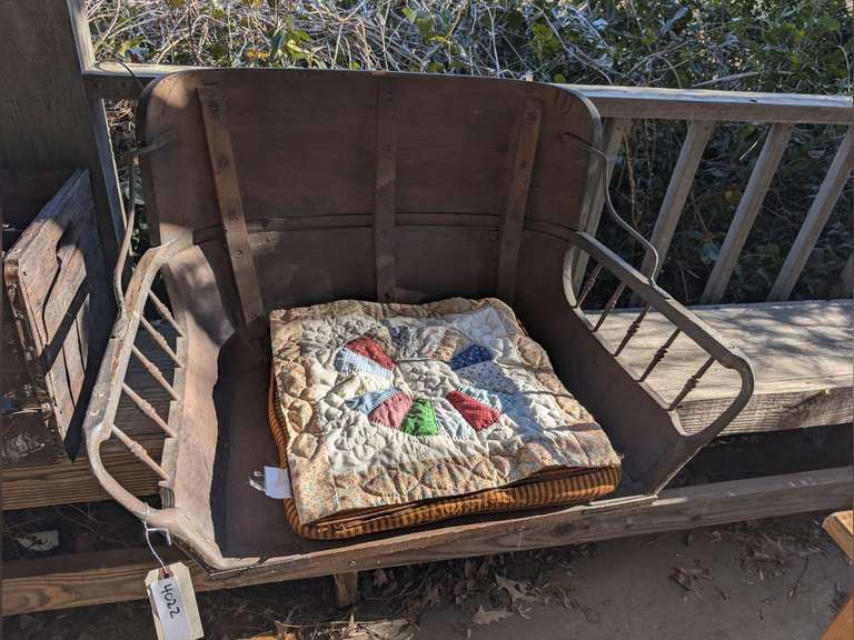ANTIQUE BUGGY CHAIR WITH STORAGE DOOR, CUSHION, AND HANDMADE QUILT PANEL image