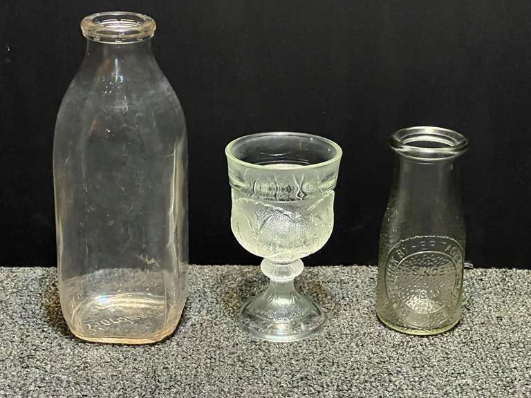 Vintage quart and pint milk bottles, also includes a vintage stemmed goblet, “Cabbage Leaf pattern, believed to be vintage Indiana glass, see pictures for details. image