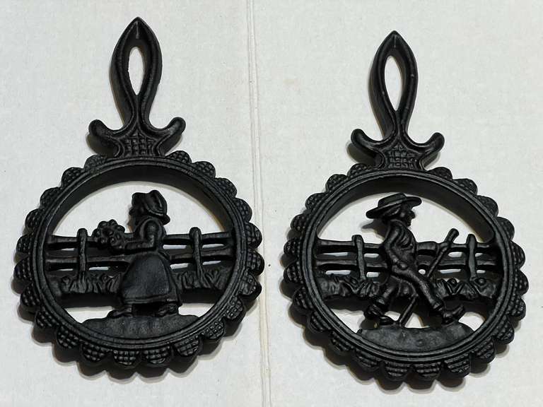 Small, cast-iron trivets, set of two, see pictures for details. image