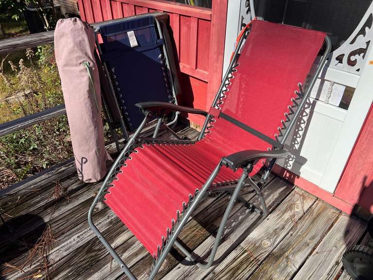 Back porch… Outdoor chairs, believed to be zero gravity lounge chairs, and camp chair, three pieces, see pictures for details. image