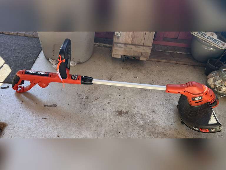 BP inside… Black & Decker electric weedeater, powers up, see pictures for details. image