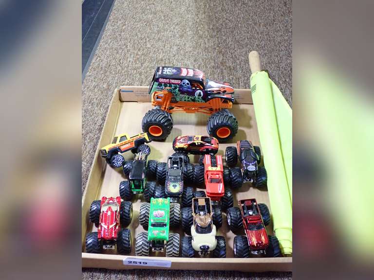 Assorted Diecast Monster Trucks and Buddy L Truck with Official Flag image
