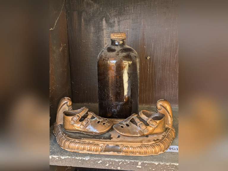 OLD DECORATIVE BABY SHOE DISPLAY AND OLD BOTTLE image