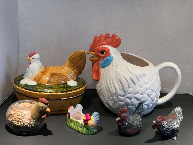 KIT… Assorted kitchen decor to include a ceramic hen pitcher, nesting hen trinket box, toothpick holder, and more. See pictures for details. image