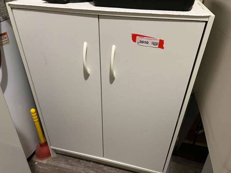 Laundry… Two door storage cabinet, has some content, see pictures for details. image