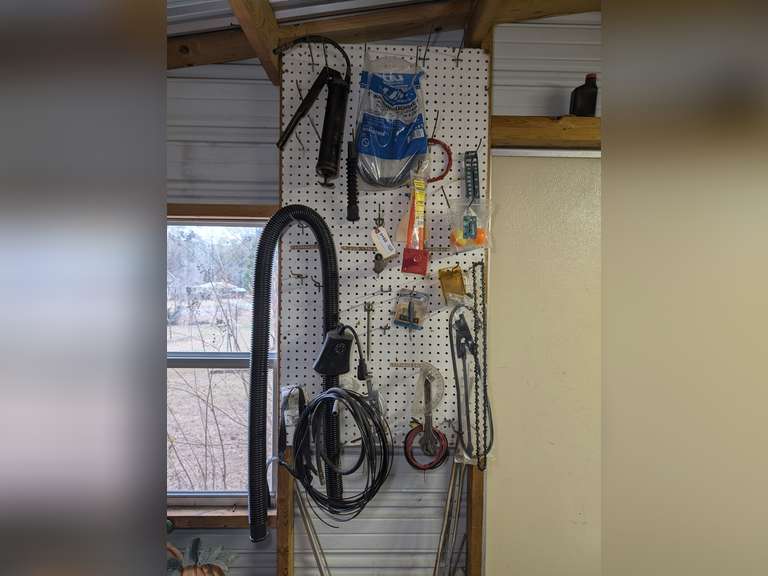 ALL ITEMS HANGING IN WALL AREA MARKED 9160 INCLUDING GREASE GUN, WASHING MACHINE HOSE, THERMOMETER, TOOLS, AND MORE image