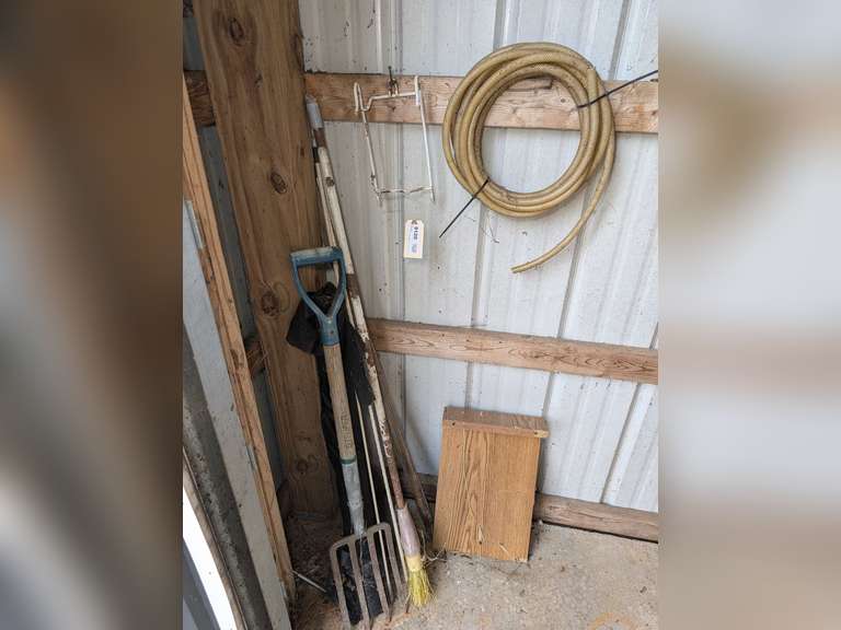 ALL ITEMS IN GARAGE FRONT CORNER MARKED 9120 INCLUDING FLEXIBLE TUBING, PITCHFORK, BROOM, TALL GARDEN STAKES, AND MORE image