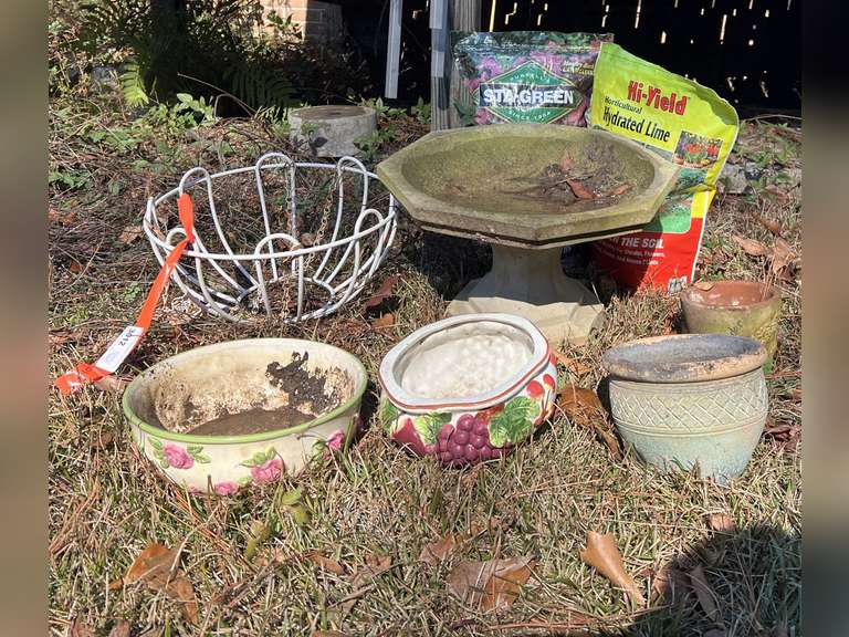 Backyard… Assorted planters, birdbath, and more. See pictures for details. image