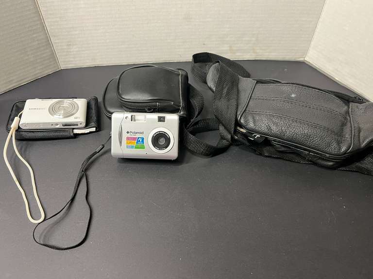 BR2… Digital cameras to include Samsung, and Polaroid. Working condition unknown, comes with storage bag and fanny pack, see pictures for details. image