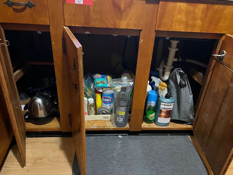 KIT… Lower cabinet lot marked 1077A, includes contents of all lower cabinets and drawers. Some items include assorted utensils, pots, pans, cookie sheets, and more. See pictures for details. image