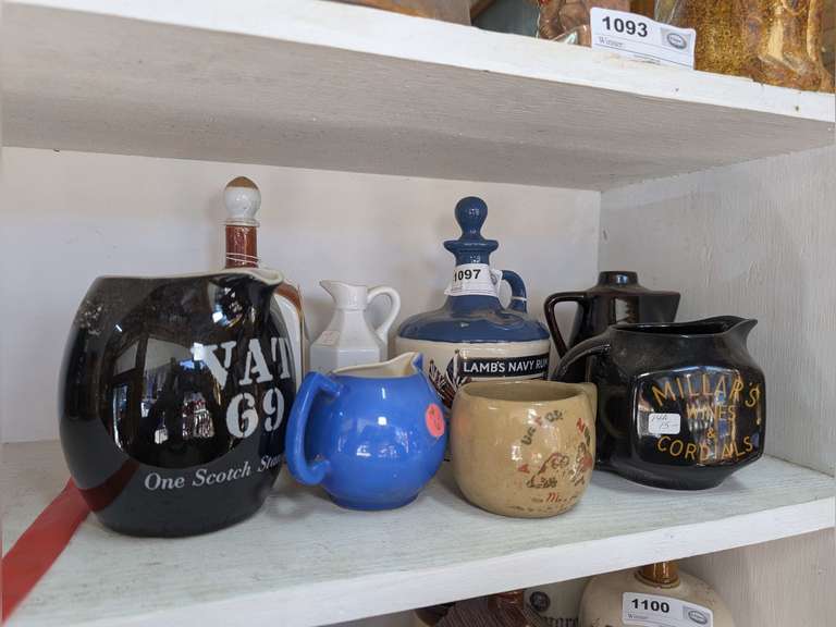 COLLECTIBLE DECANTERS AND POTTERY IN SHELF AREA MARKED 1097 image
