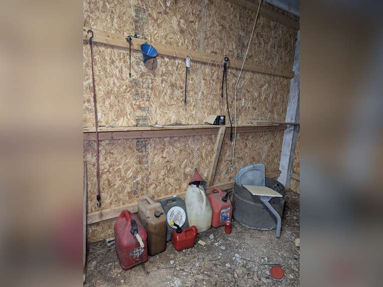 ALL ITEMS ON AND ON THE GROUND BENEATH BARN WALL MARKED 9190 INCLUDING GAS CANS, OIL CATCH CAN, FUNNEL, NAILS, AND MORE image
