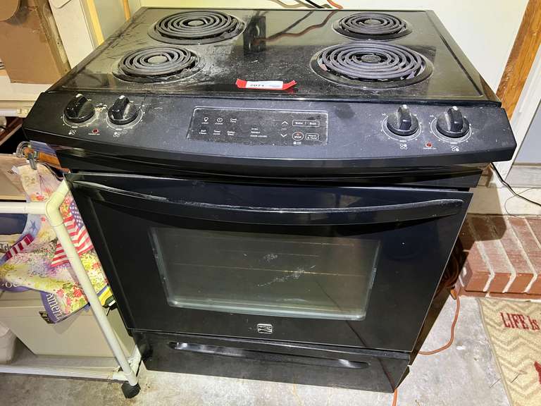 Garage… Kenmore electric four burner stove, seller states this piece was working when pulled out. See pictures for details. image