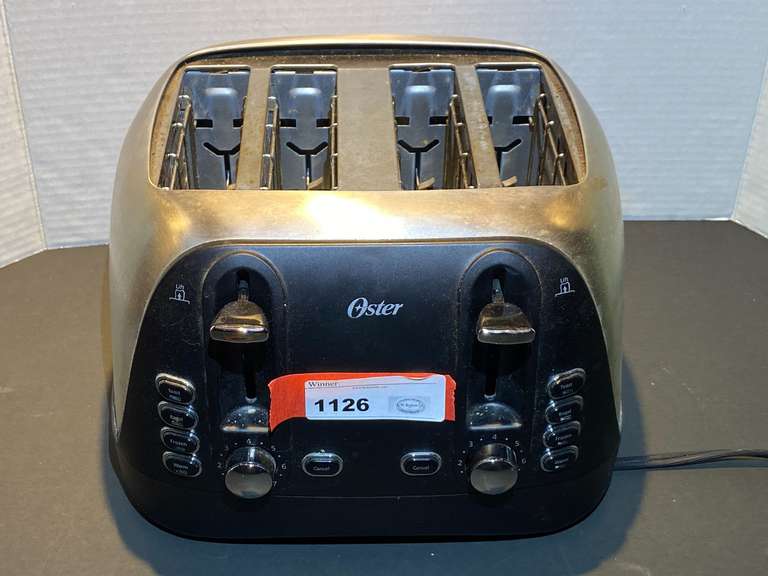 DR… Oster four slice toaster, powers up, see pictures for details. image