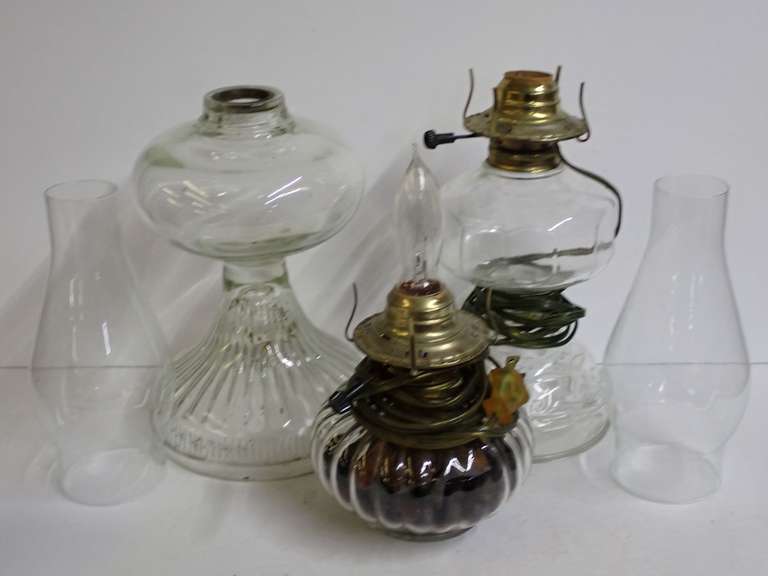 Collection of Clear Glass Oil Lamps with Chimneys image