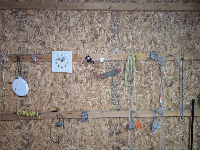 ALL ITEMS IN WALL AREA MARKED 9194 INCLUDING MINNOW NETS, GASOLINE SIPHON TUBE, CRICKET BASKET, ABU GARCIA 5000 BAITCASTING REEL, AND MORE image